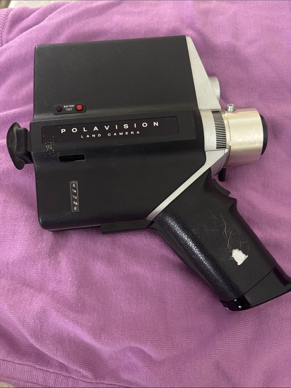 Antique Polaroid Polavision Land Camera in Black and Silver on Pink